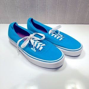 Bright blue vans, in good condition.